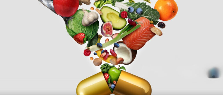 Из золотой капсулы высыпаются различные полезные продукты, включая фрукты, овощи, орехи, рыбу и другие ингредиенты